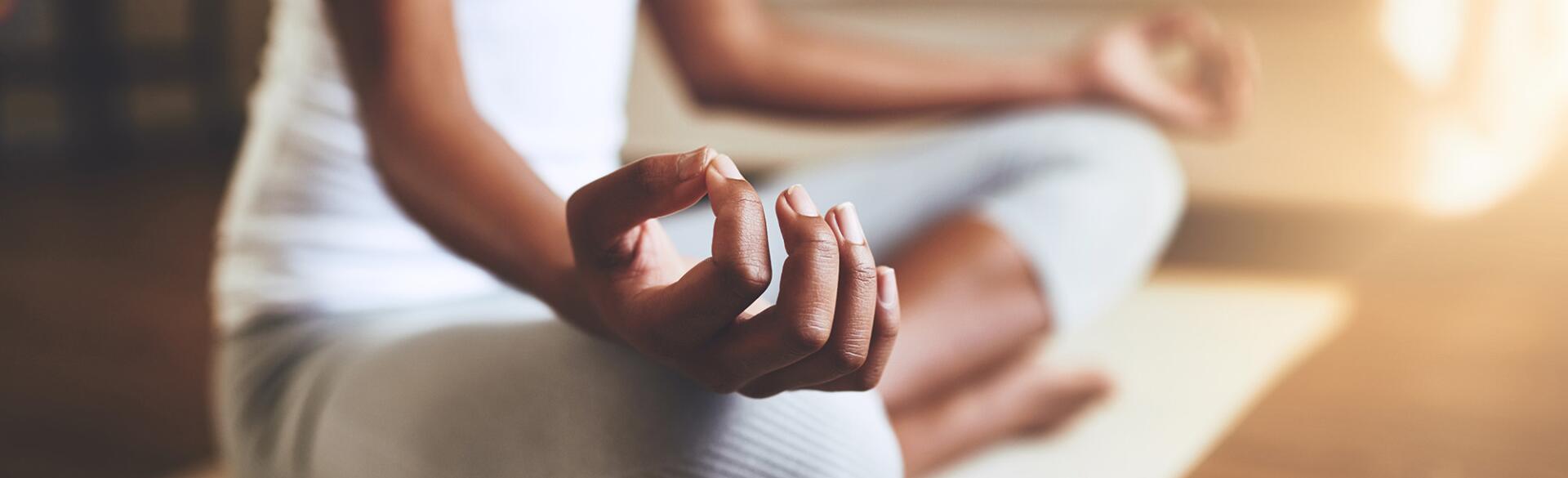 woman practicing guided meditation at home