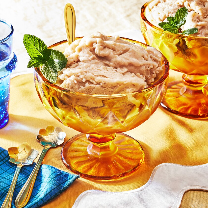 Vanilla "Nice Cream" in a golden dish garnished with mint