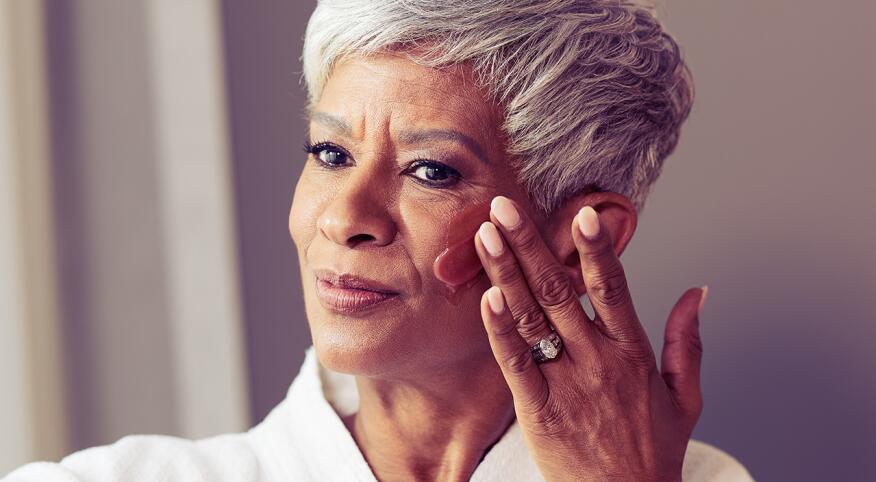 Woman applying face cream