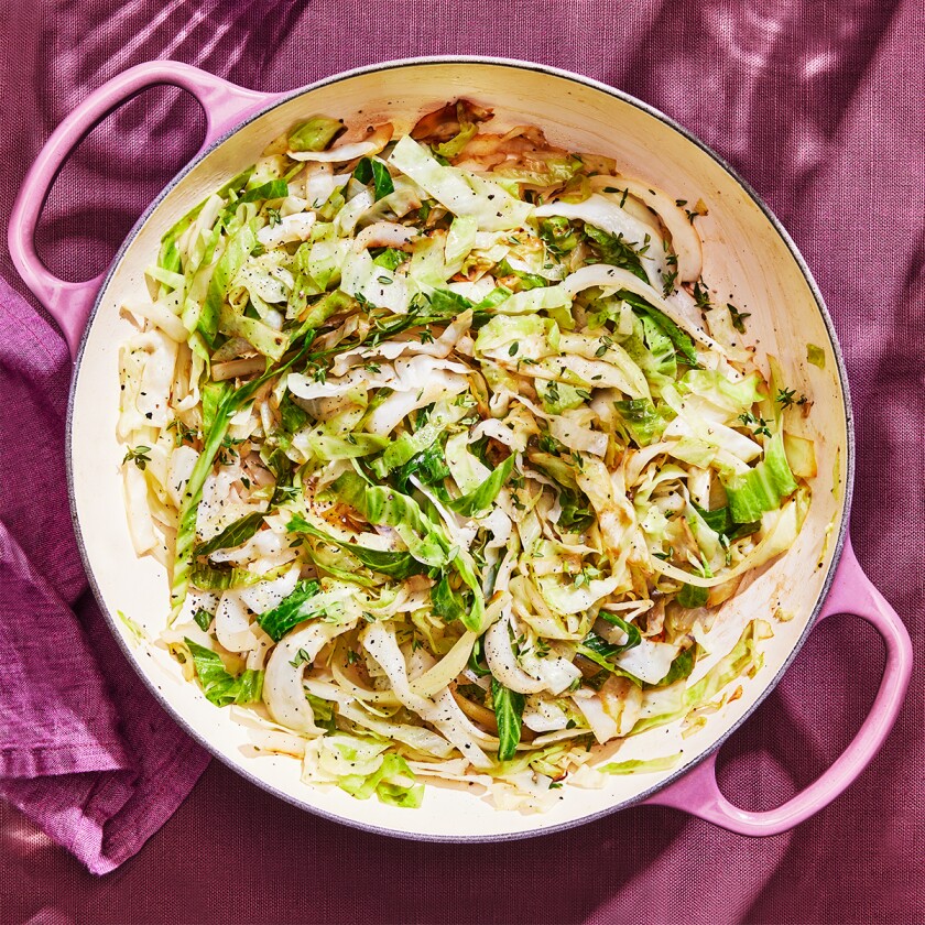 Sauteed cabbage on purple background