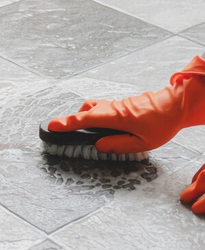Orange Gloves Scrub Floors