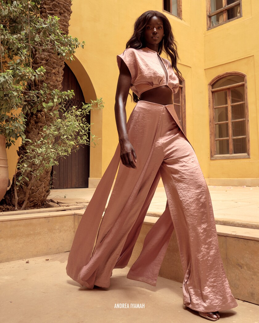 Woman in wide leg pink jumpsuit