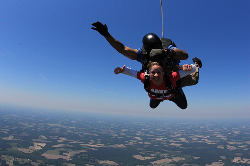 Author Heather Sweeney Skydiving, in a helicopter and paragliding