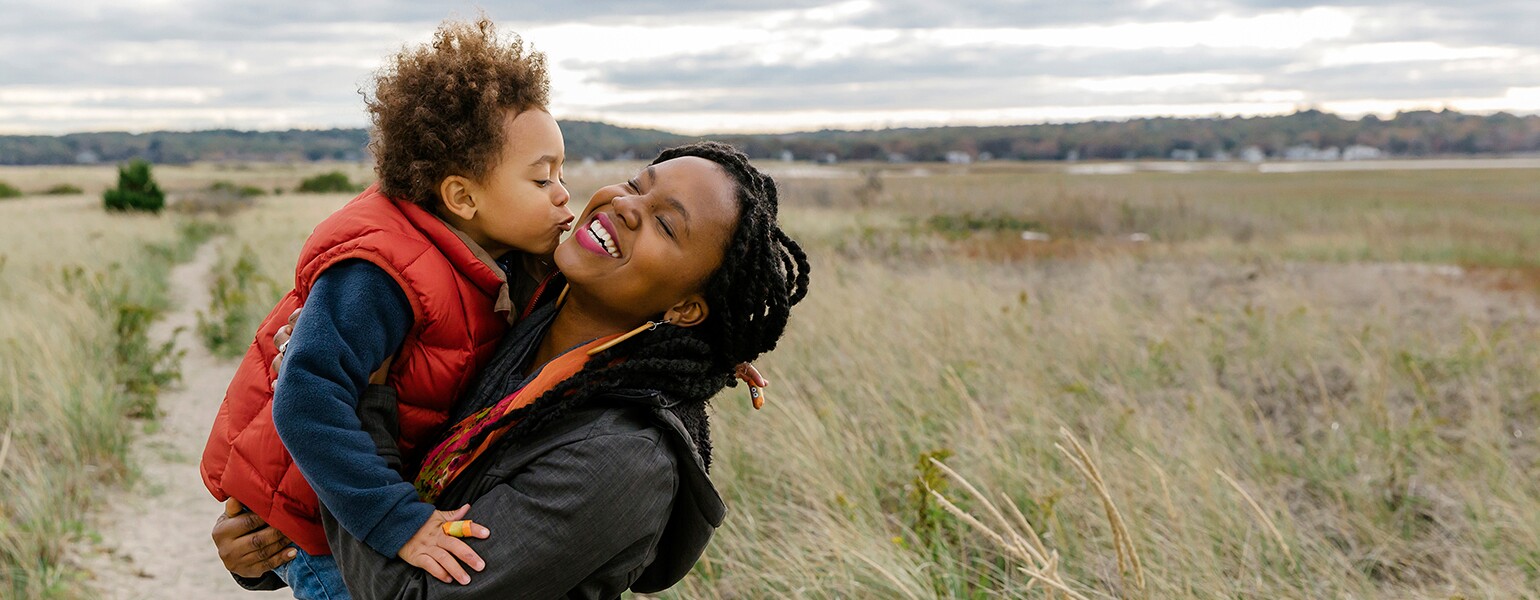 image_of_black_mother_holding_small_child_against_landscape_Stocksy_txpf9d9135aWFX200_OriginalDelivery_1284835_1540.jpg