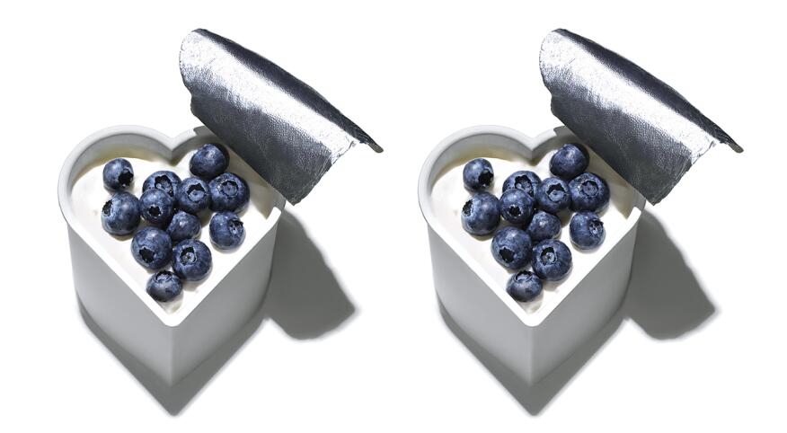 Two cups of blueberries in hear shaped yogurt containers