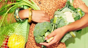 Close up of a woman holding vegetables