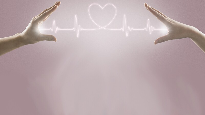 Two hands with a heart rate line connecting them