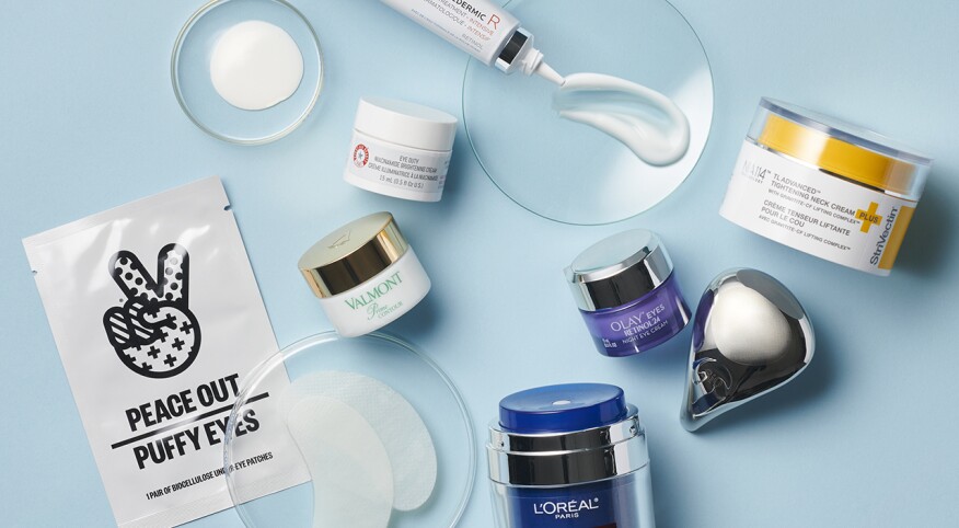 Overhead image of beauty products on a blue background.