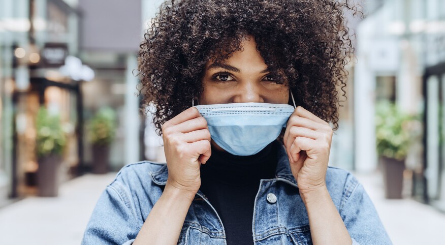 image_of_woman_wearing_face_mask_GettyImages-1264814114_1800