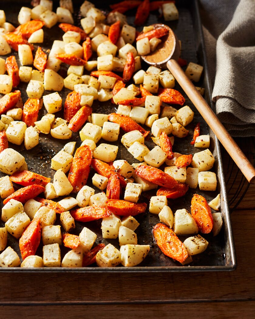 Root vegetable recipe styled on autumnal rustic background