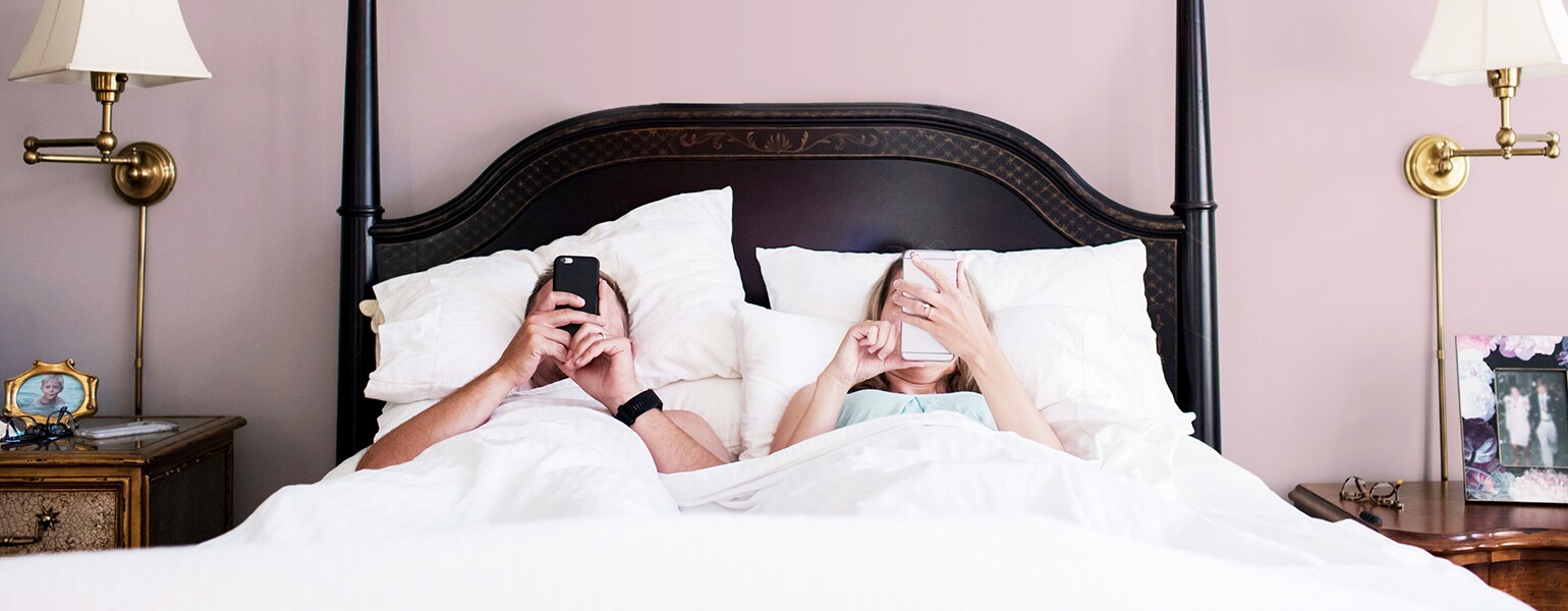 On The Morning Of A 40th Birthday, A Couple Unenthusiastically Check Their Phones