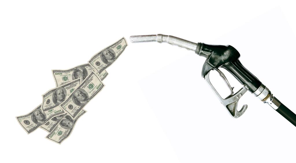 image_of_dollar_bills_coming_out_of_gas_GettyImages-157187062_1800