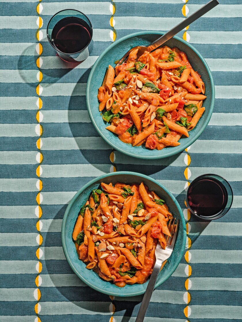Two bowls of red lentil pasta from above