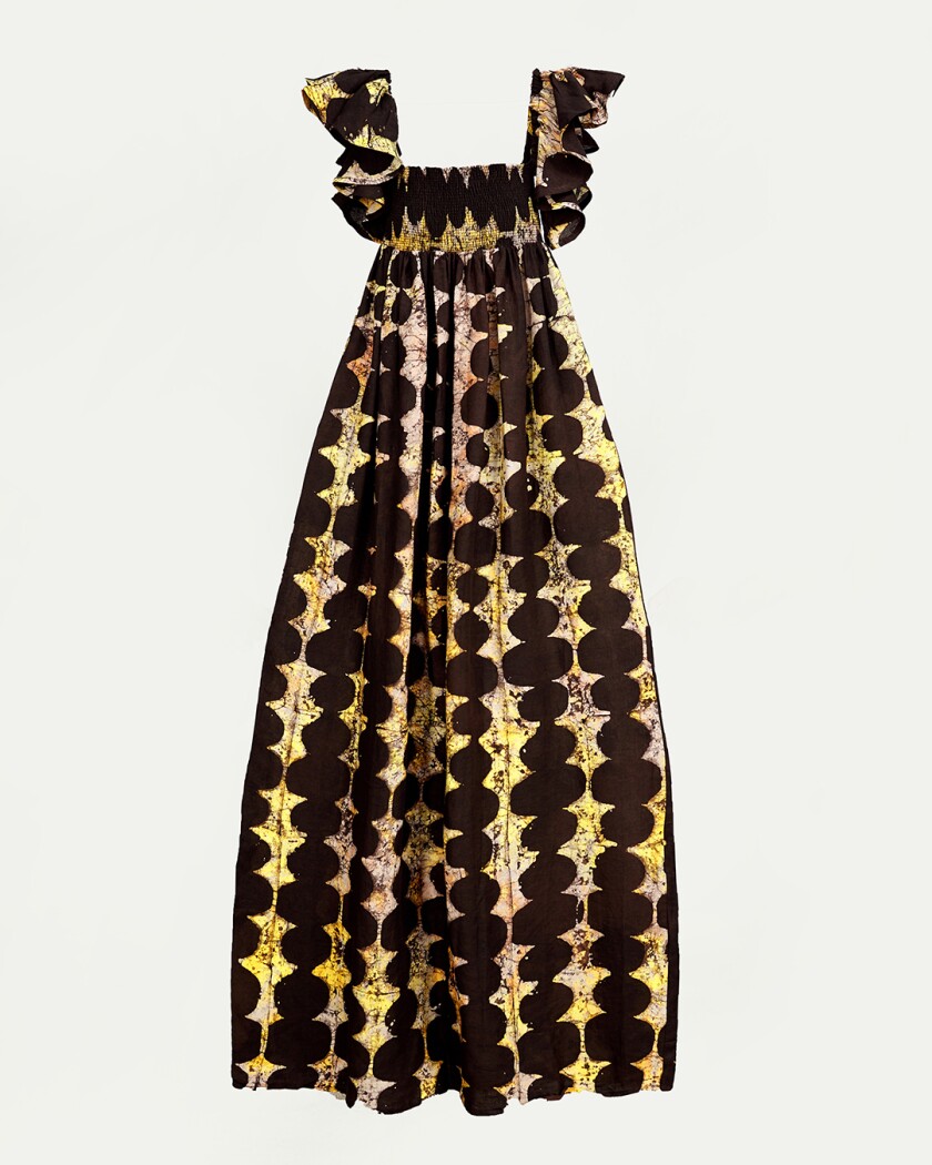 Black and yellow printed dress on a white background
