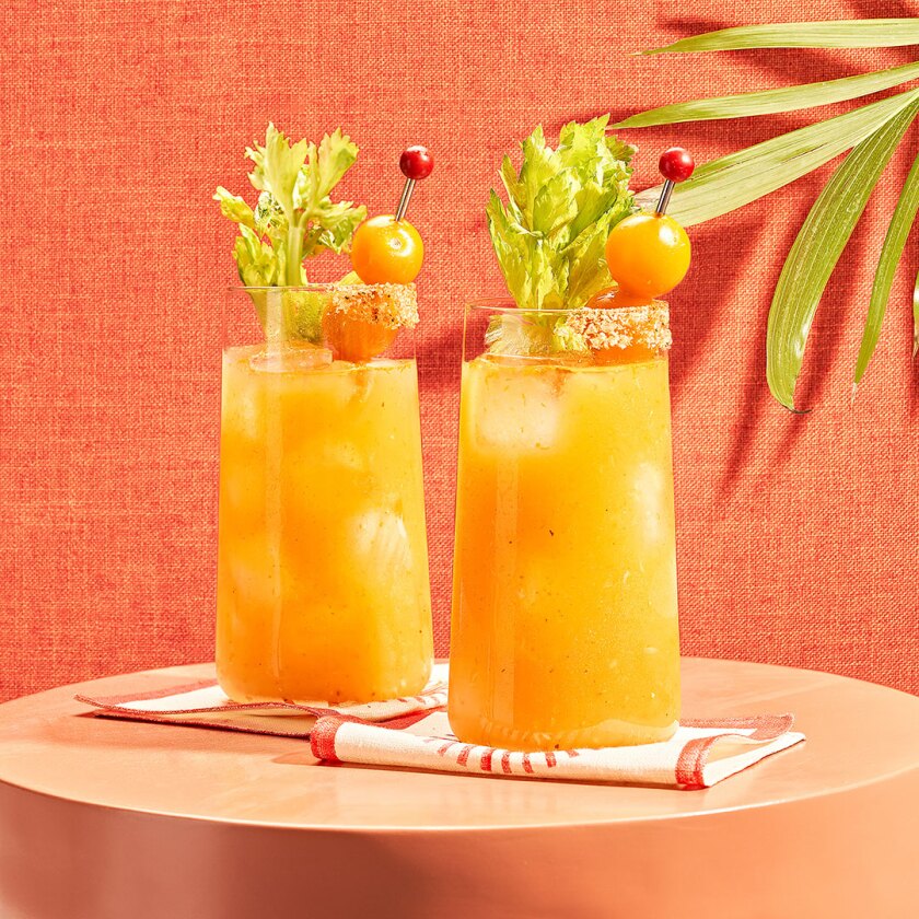 Sunset summer cocktail styled on colorful background