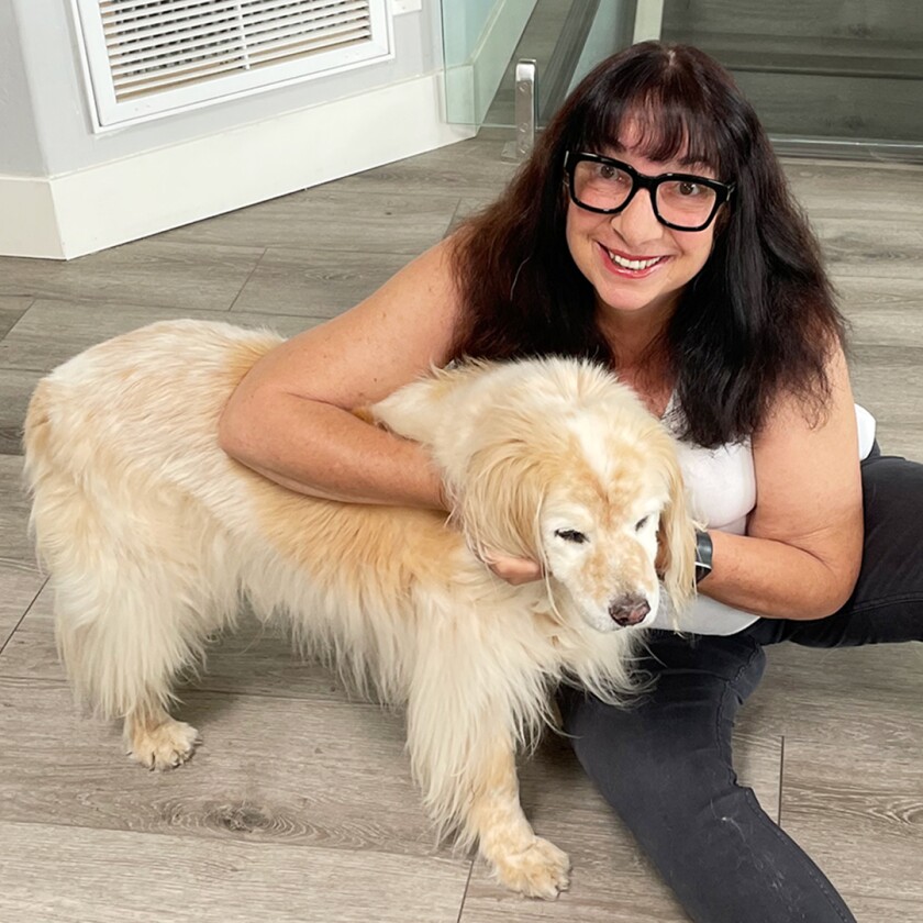 Ann Brenoff poses with her dog Harry. Courtesy of Author