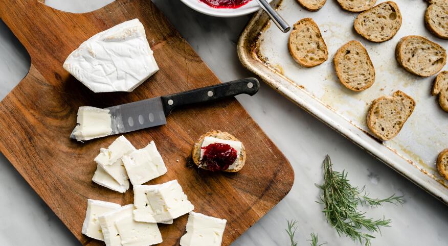 Making Cranberry Brie Toast Bites easy appetizer for a girls night in