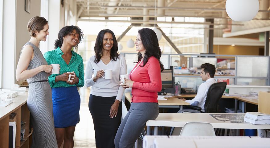 group of 4 women friends talking and drinking coffee