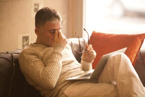 Stressed out man with laptop