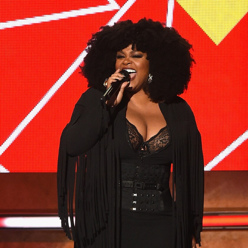 Jill Scott performing on stage