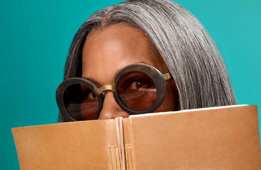 woman looking over journal