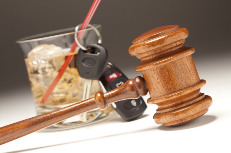 Gavel, Alcoholic Drink & Car Keys on a Gradating to White Background - Drinking and Driving Concept.