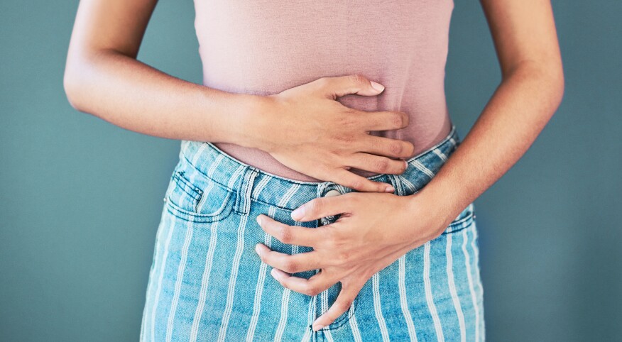 photo_of_woman_holding_stomach.png