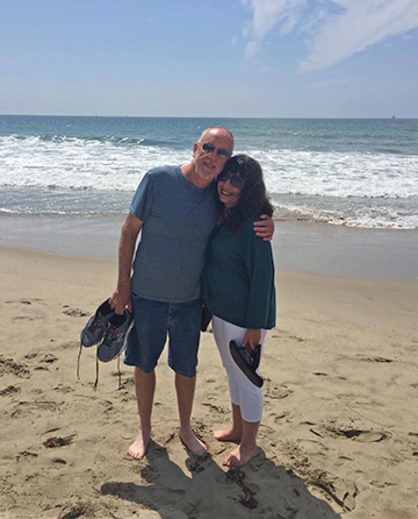 Ann Brenoff and her husband on the beach