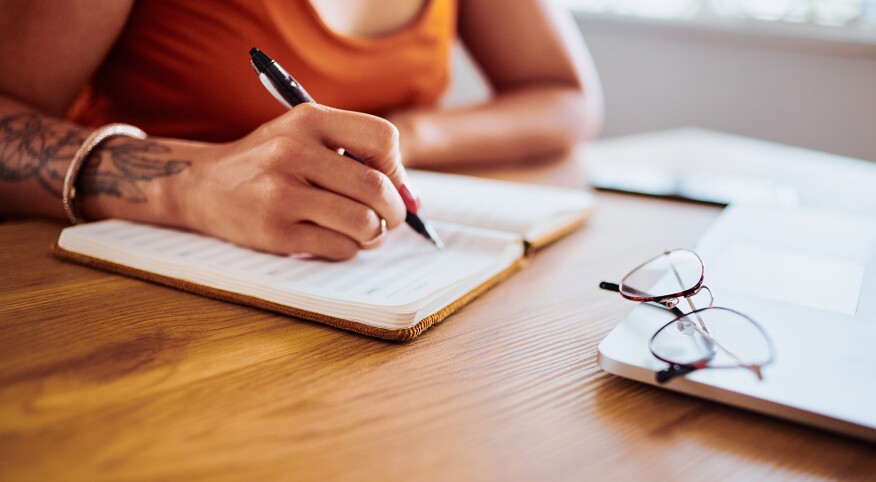 image_of_woman_writing_in_notebook_GettyImages-1208521371_1800