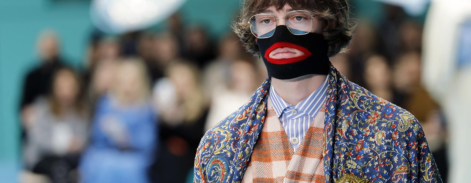 A photo of a model from the Gucci fashion show, featuring a face warmer made to resemble blackface.