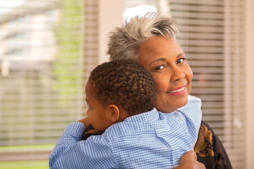 African American woman hugs grandson