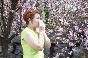 Woman sneezing around pollen