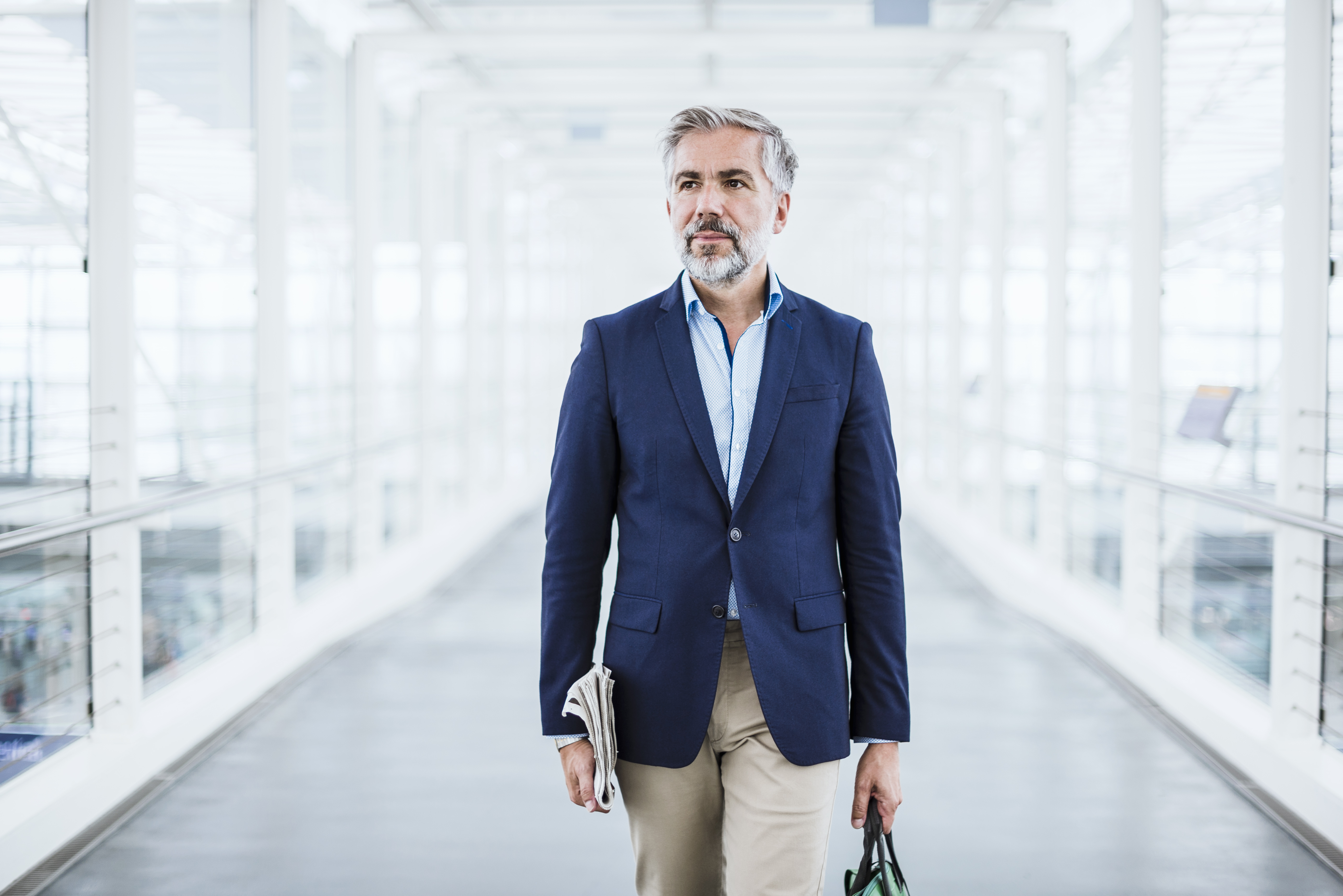 Businessman walking in passageway - stock photo