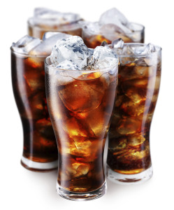 Four glasses of cola on ice