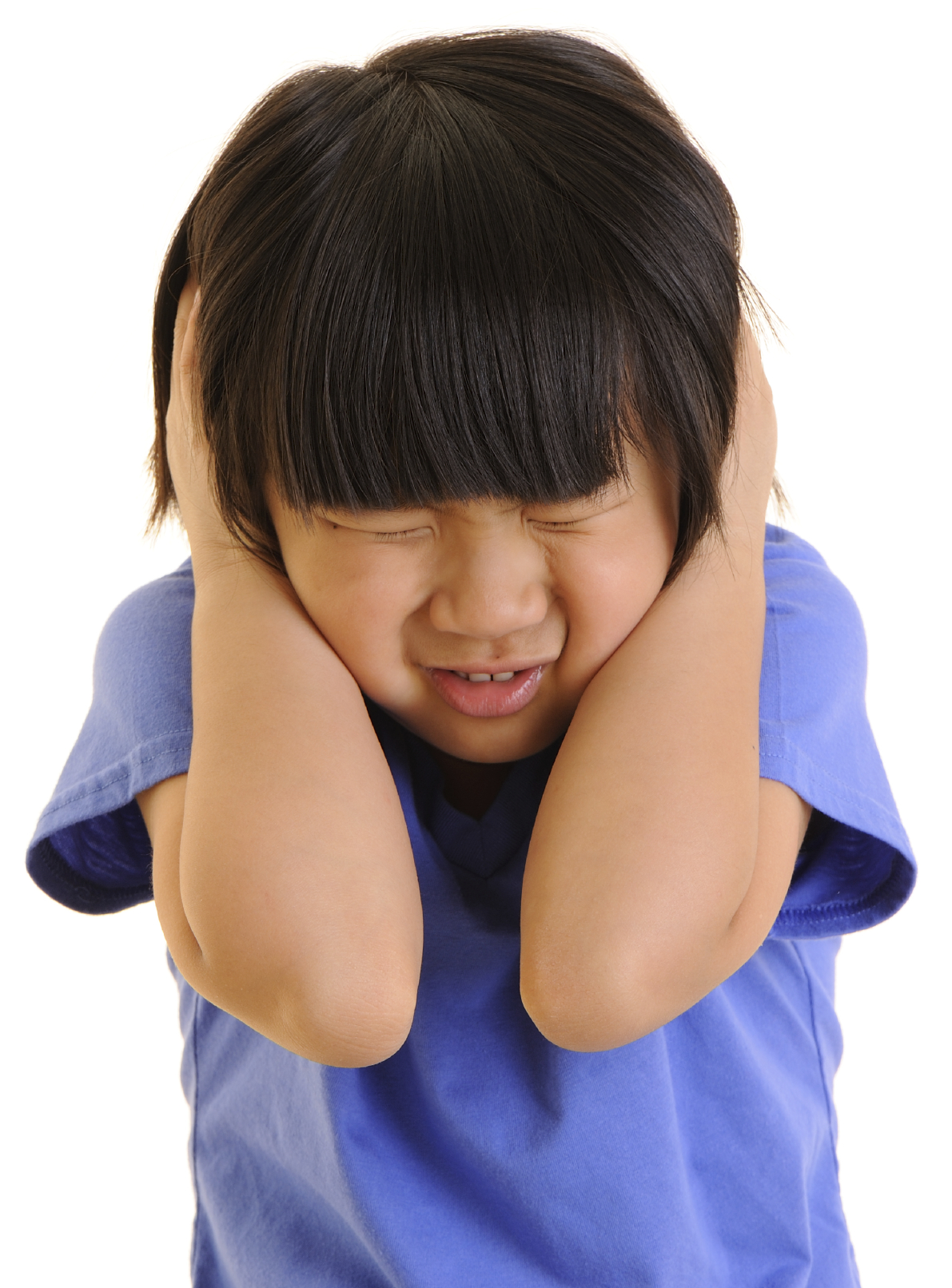 Young girl with hands over ears